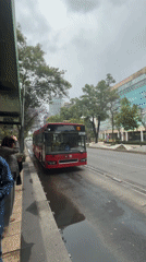Metrobus Route 523 arrives at stop, passengers board