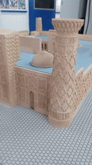Ornate architectural scale model on display, multiple close-up angles