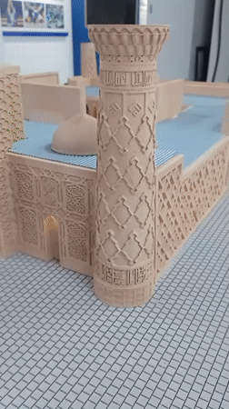 Ornate architectural scale model on display, multiple close-up angles