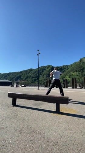 Bench tricks at a riverside skate spot in Divnogorsk