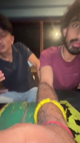 Friends hanging out indoors, phones out, casual vibes.