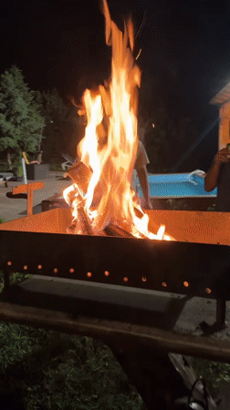Evening backyard gathering with fire pit in Bulgarian village