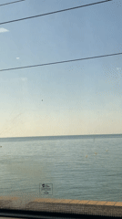 Train passenger films calm Mediterranean waters near Barcelona