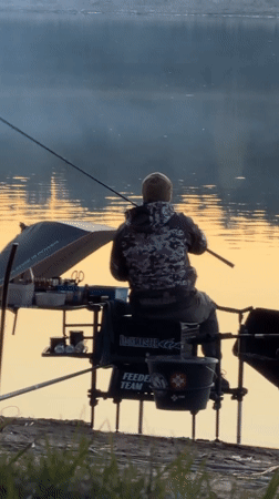 Two anglers fish at sunrise near Chaykovsky, Russia