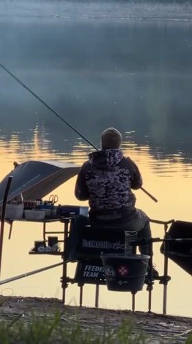 Two anglers fish at sunrise near Chaykovsky, Russia
