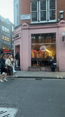 Man demonstrates with megaphone outside London juice shop