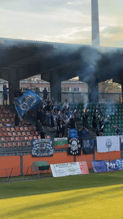 Soccer match held in Lovech stadium with irrigation active