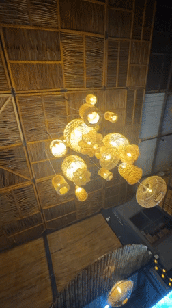 Couple dances at thatched-roof restaurant in Mirissa, Sri Lanka