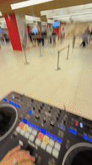 DJ performs with mixing console in Khimki mall