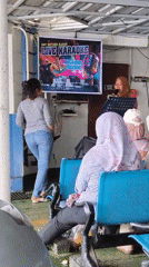 Ferry passengers enjoy live karaoke session during Indonesian boat journey
