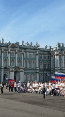 Russian flag gathering at ornate yellow building square