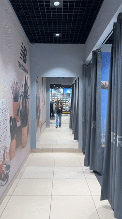 Woman tries on clothes at Kryvyi Rih store