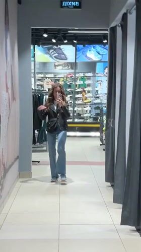 Woman tries on clothes at Kryvyi Rih store