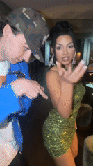 Woman in green sequined dress dances at Vienna bar