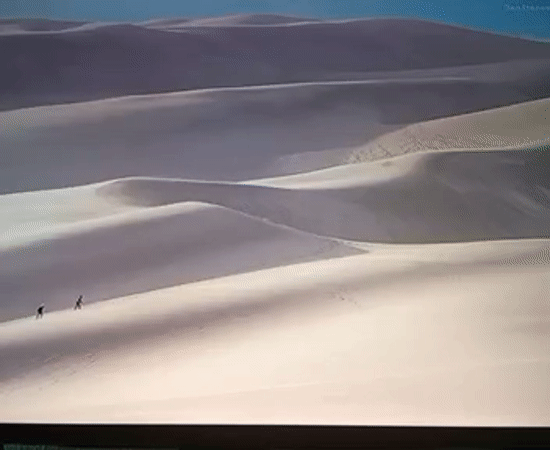 Sand dunes and snowy rock formations in a Moldova desert landscape