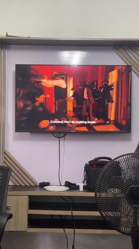 Abuja resident documents TV viewing and city views