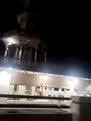 Illuminated tower building filmed at night in Keudegeudong, Indonesia