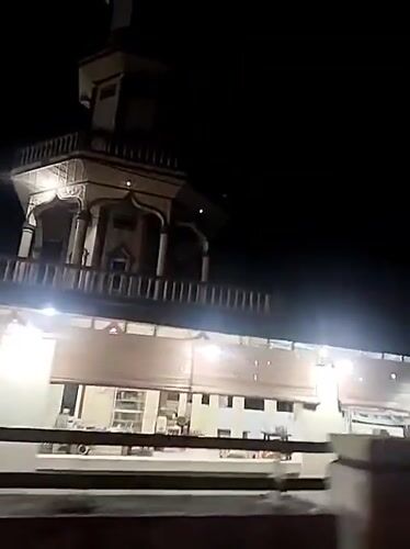 Illuminated tower building filmed at night in Keudegeudong, Indonesia