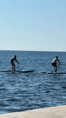 Water bikes and beach umbrellas on a calm Sevastopol afternoon