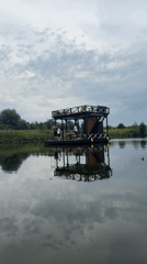 Paddleboarding a calm Russian river past chapels and stone bridges