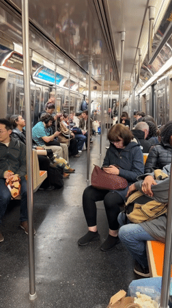 NYC subway passengers observed in typical evening commute scene