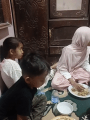 Casual floor meal shared among a small group