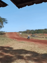 Dirt bike riders practice jumps at Nairobi motocross track