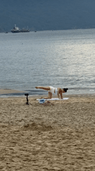 Woman records beach workout session in Đà Nẵng