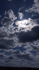 Mixed cloud formations documented over Russian countryside field
