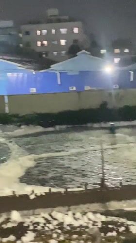 Foam-covered water filmed at Dhaka industrial facility