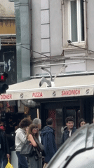 Morning street activity recorded near food shop in Varna