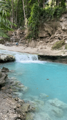 Natural waterfall and turquoise pool documented in Samal forest