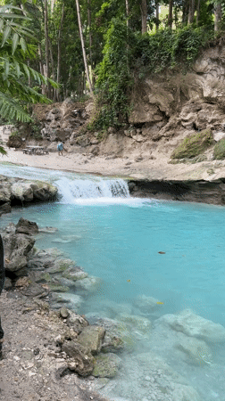 Natural waterfall and turquoise pool documented in Samal forest