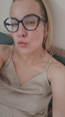 Woman in purple glasses photographed indoors in Sochi