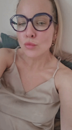 Woman in purple glasses photographed indoors in Sochi