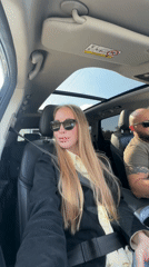 Car passengers photographed during daytime journey in Sirius, Russia