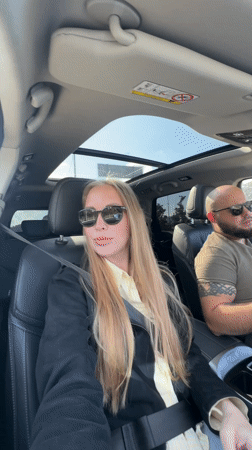 Car passengers photographed during daytime journey in Sirius, Russia