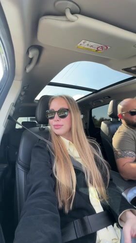 Car passengers photographed during daytime journey in Sirius, Russia