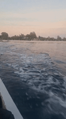 Sunset beach activities captured along Indonesian coast