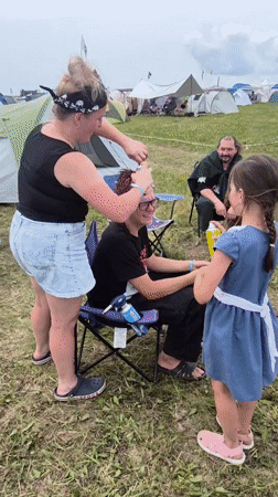 Lazy summer festival morning: guitar, grilled kebabs, and campsite life