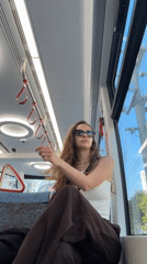 Woman rides tram in Bat Yam, Israel