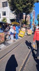 Busy street life along a sunny Surakarta thoroughfare