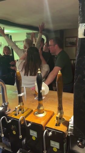 Pub patrons dance on bar counter in Boxford evening