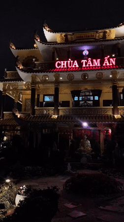 Buddhist Temple Complex Illuminated During Evening Hours in Da Lat