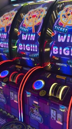 Families enjoy afternoon arcade gaming session in Kudrovo, Russia