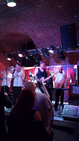 Live band night at a packed brick-walled Irish venue