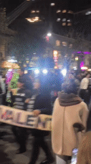 Nighttime parade fills La Paz streets with bands and stilt walkers
