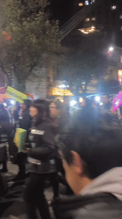 Nighttime parade fills La Paz streets with bands and stilt walkers