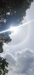 Children play as sun halo appears over Vallecito, Venezuela