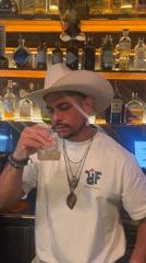 Barcelona afternoon: bartender samples drink, witness captures architectural skyview